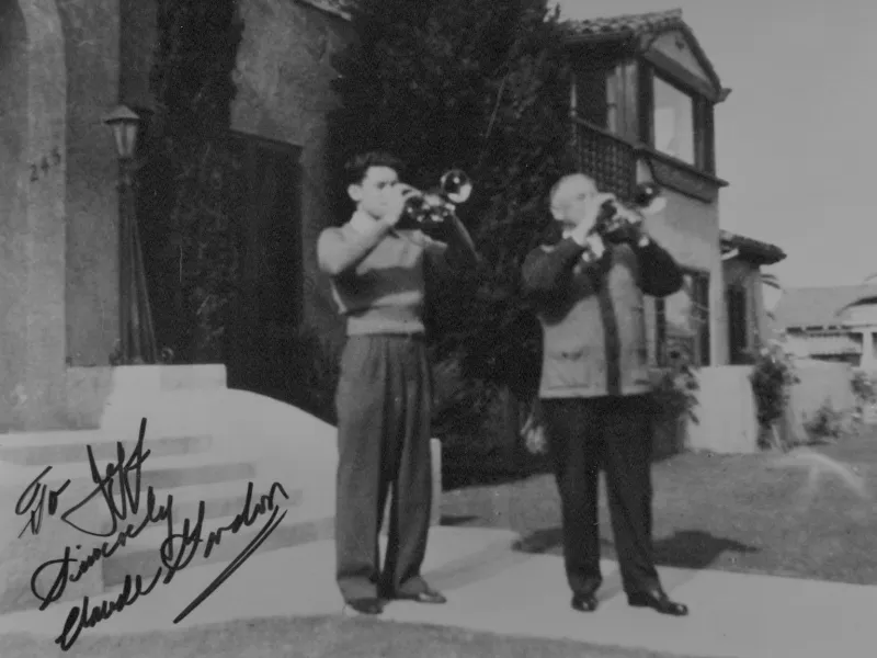 Claude Gordon and legendary cornetist Herbert L. Clarke playing together outside Clarke's Long Beach home, representing the historic Clarke–Gordon trumpet pedagogy tradition.